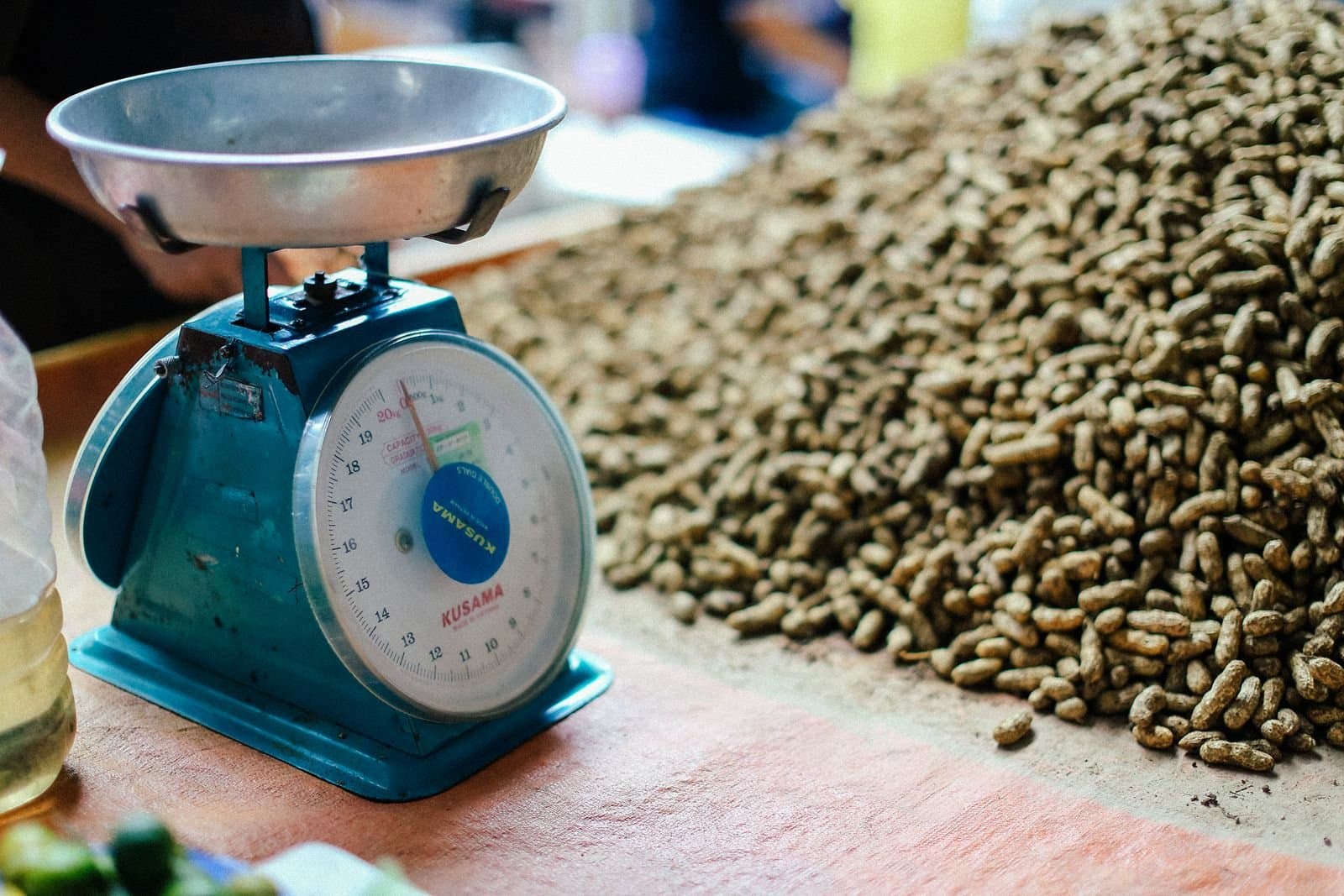 Produce being weighed on a platform scale at intake while the delivery is recorded