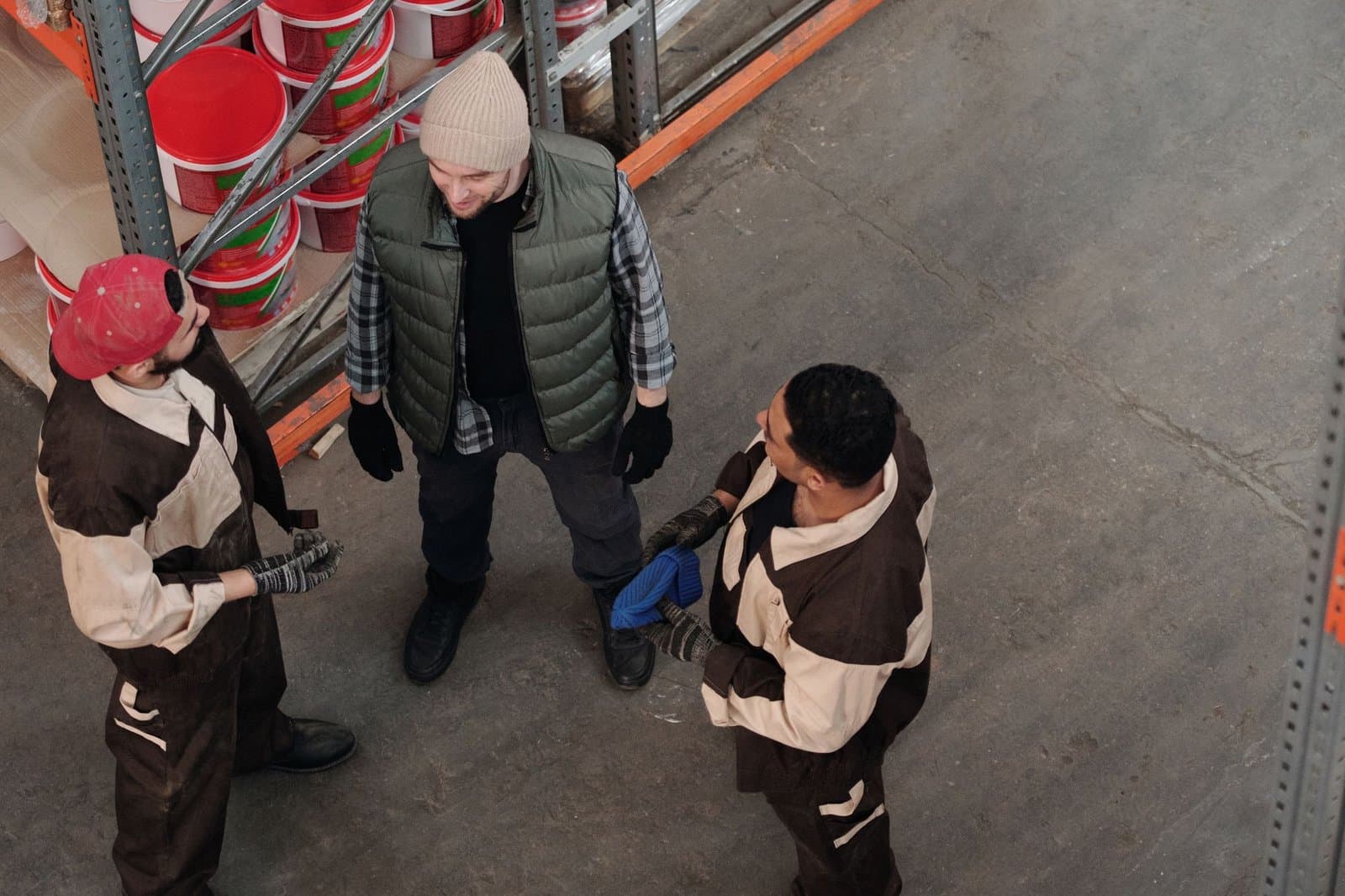 Operations team gathered for a short morning briefing in front of the warehouse