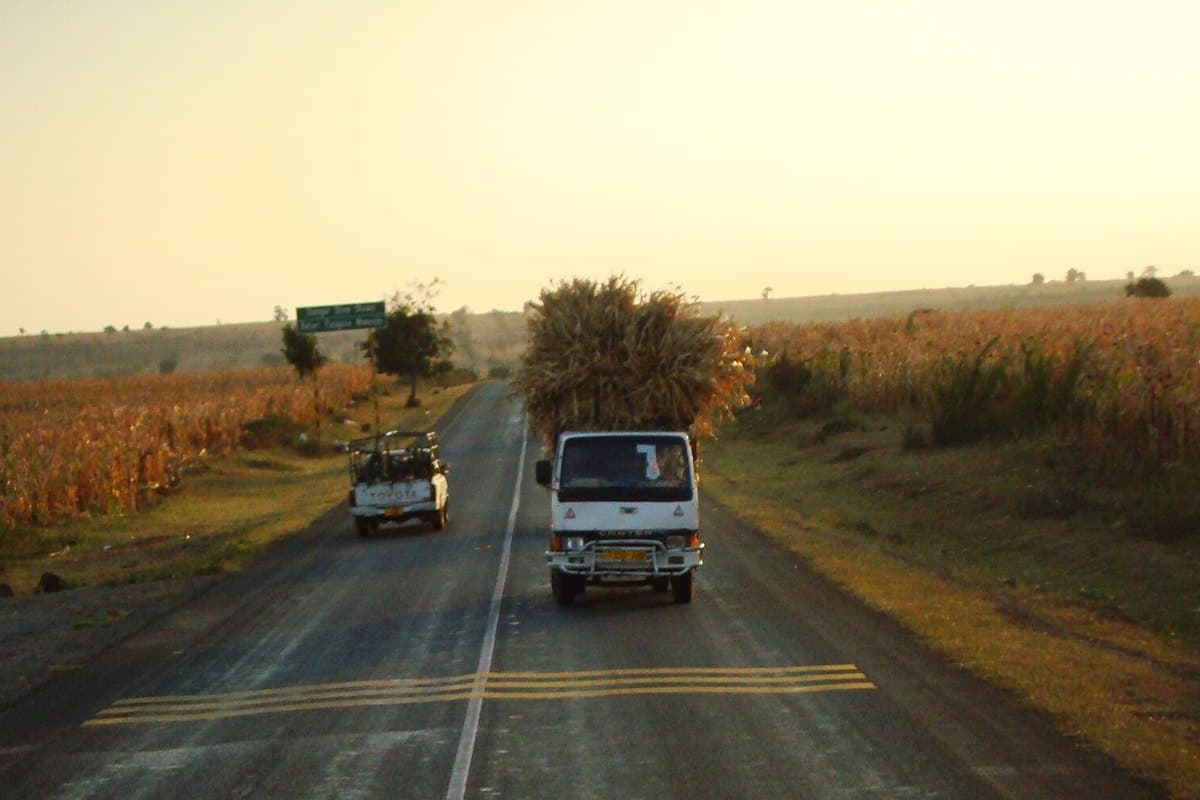 Distribution truck on an upcountry road carrying commodity to a regional customer